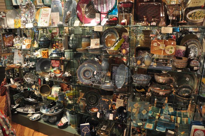 Shelves of handmade pottery and other items available at The Artisans in McLean. 