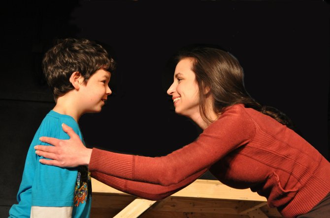 Brendan Dure as Little Scrooge and Eryn Gleason as Fan in rehearsal for the Providence Players’ production of the family holiday classic “A Christmas Carol.” 