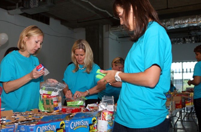 Food for Others volunteers collect, sort and package food for those in need. 