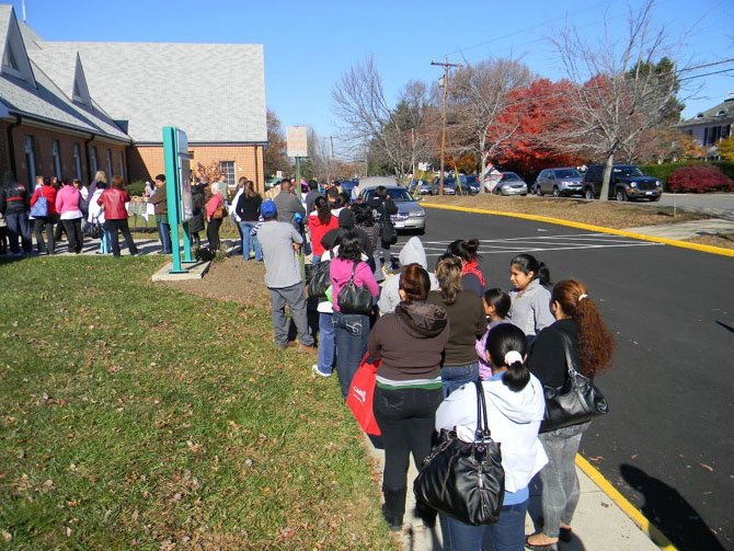 Needy families wait on line to receive groceries and gift certificates at Trinity Presbyterian Church in Herndon on Nov. 16. Sixty families an hour were escorted through the church supermarket during seven hour LINK event. www.linkagainsthunger.org 703-437-1776