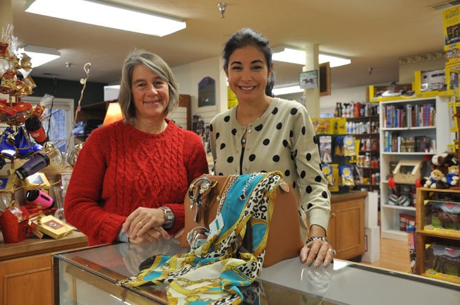 Owner Sarah Kirk, left, and jewelry designer Patricia Barta with a selection of purses and other leather goods, Italian silk scarves and Patricia Barta jewelry are available at The Saddlery.
