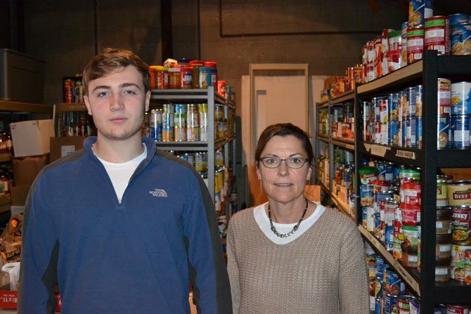 Forrest Crane, Senior at Potomac School, and Potomac School teacher Tracy Jaeger, helped Share prepare for Thanksgiving distribution day.