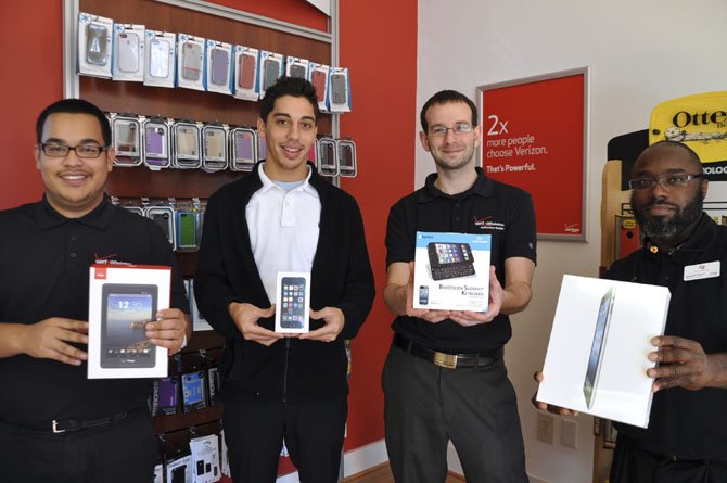 Verizon salesmen Luis Navarro, Luis Rivera, Manager Jason Vogel and Jermaine Boone are available to help select the perfect tech gift.