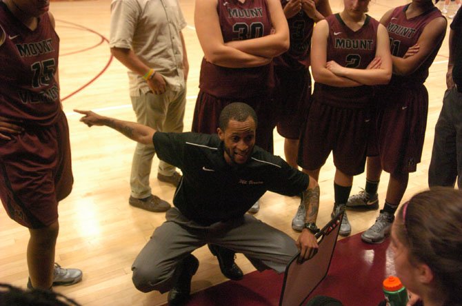 Mount Vernon head girls’ basketball coach Courtney Coffer talks to the Majors during a game against Oakton last season.