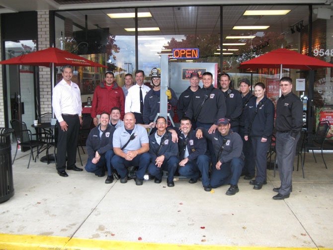 Members of the City of Fairfax Fire Station 403: (back row): Shane Mitchell, Roger Hundal, Clinton Haynes, Dave Rohr, Joe Waters, Page Whitacre, Joshua McCoin, Keith Virts, Daniel Richardson, Jessica Merrill and Dan Lowe. (Front row): Jason Gorres, Joe Charley, Allen Nicholson, Ronald Teribery, John Jeniec and Henry Requejo.