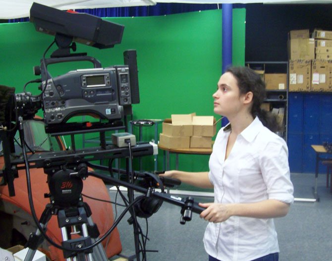 Camille Speer of Great Falls, a student at the Fairfax Academy for Communications & the Arts, looks at a camera in a studio at the school. This is Speer’s second year in the school’s Professional Television Production class.