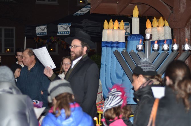 More than 50 persons attended the evening celebration of Chanukah at the Herndon Town Square on Sunday. Afterwards everyone was invited to enjoy latkes and donuts.