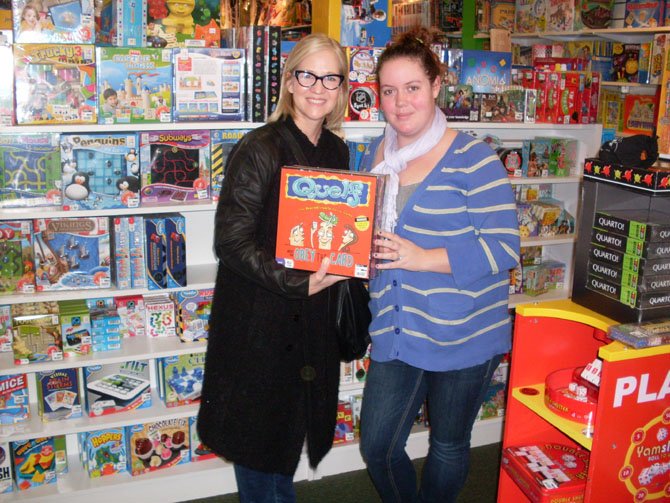 Customer, Michele Hopkins, and Molly Gilroy, sales associate, at Child’s Play Toys.