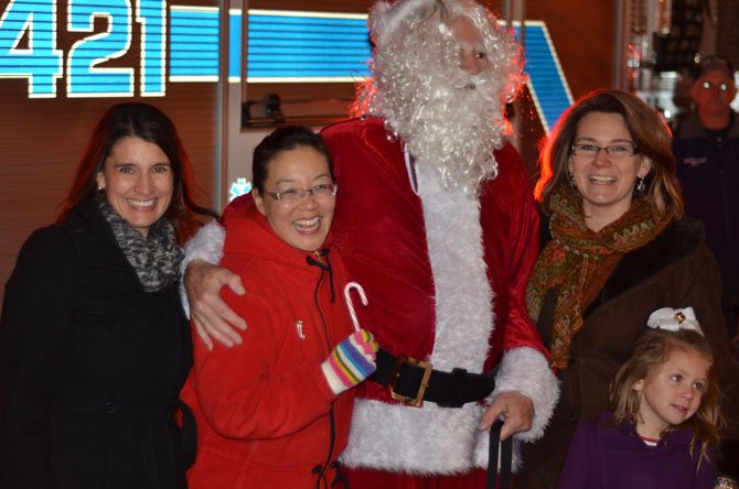 From the left Herndon Town Council member Melissa Jonas, Town Council member Grace H. Wolf, Santa Claus, Mayor Lisa Merkel, and Lila Merkel.