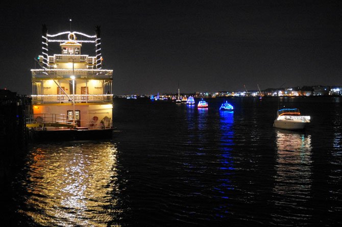 Boats line the Potomac River alongside The Cherry Blossom during the 2013 Parade of Lights.