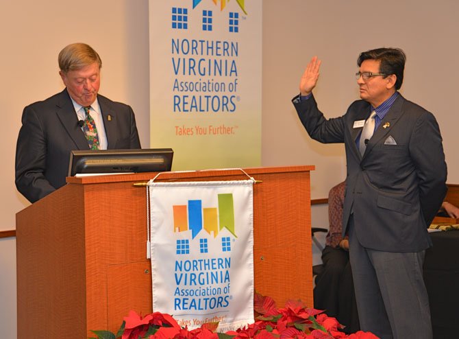 Thomas Stevens, past Chair of the NVAR, administers the oath of office to Mario Rubio, in-coming Chairman of the Board.