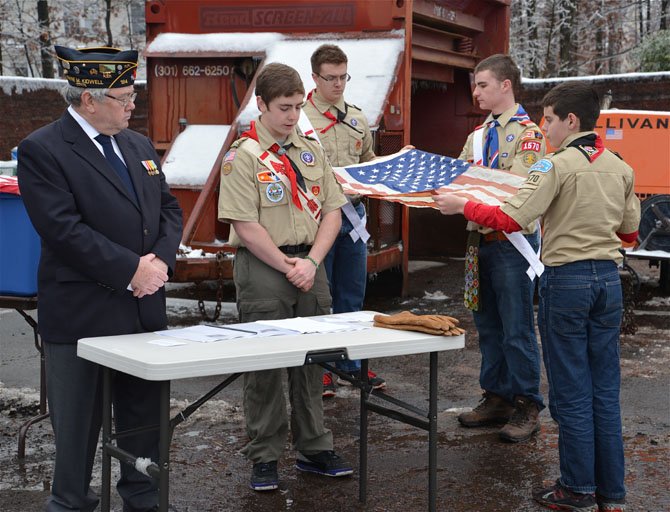 The First Flag for retirement is presented. Once presented and inspected, scout Patrick Nugent took the flag to the fires.