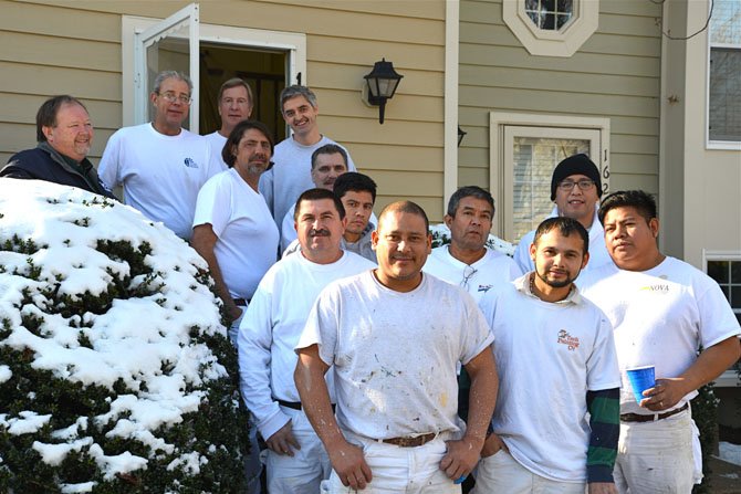 The Good Guys – volunteers from companies that are members of the local chapter of the Painting and Decorating Contractors Association of America who spent the day painting a townhouse for a client of Cornerstones (formerly Reston Interfaith) capture the moment of their fellowship and community spirit outside the project property.