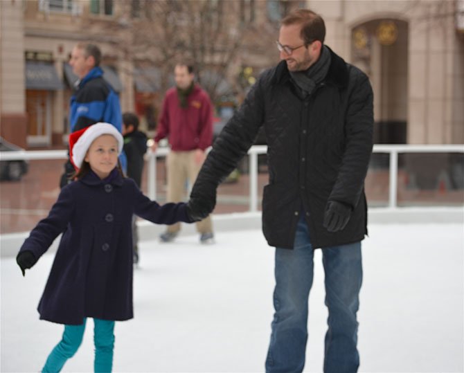 Lila Sheingate hangs on to dad Adam. The pair came in from Baltimore to visit Reston relatives. When asked if Miss Lila thought she was ready for Sochi, she replied, "Well, maybe!" Confidence is key.