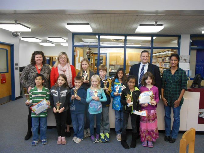 Front Row: Tyler, Emma, Drew, Keira, Nandana and Laura. Back Row: Principal Ann Gwynn, Assistant Principal Melissa Tochterman, Abigail, Toby, Emaan, Assistant Principal Ray Correllus, Reflection Committee Chairperson Pavithra Rajesh.