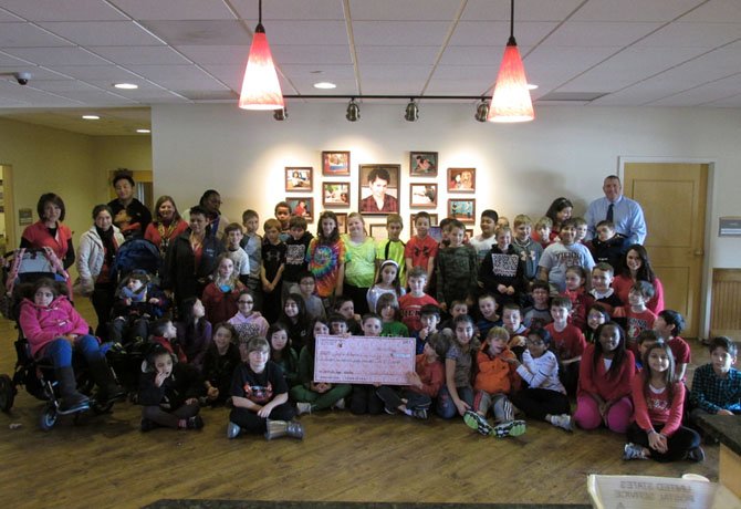 Vienna Elementary fourth graders presenting a check of $2,156.09 to Jill’s House.