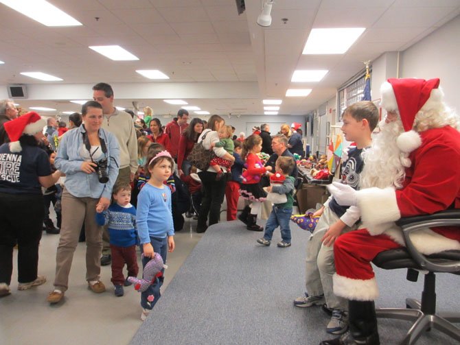 Santa Claus arrived to cheer at the Vienna Volunteer Fire Department’s breakfast with Santa. He listened to children share their Christmas lists and sat for photos with them.