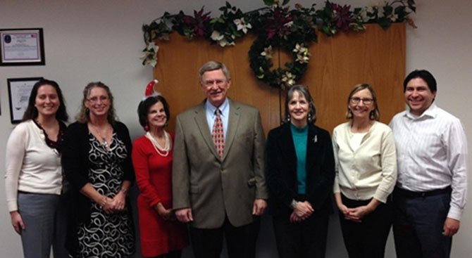 Supervisor Foust (in the middle) with his office staff. From left: Patty Dinkelmeyer, Jenny Phipps, Jane Edmondson, Donna Keefe, Julie Ide, Nen Wiles.