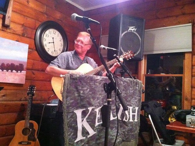 Glen McCarthy playing guitar with the Irish band, Keltish.