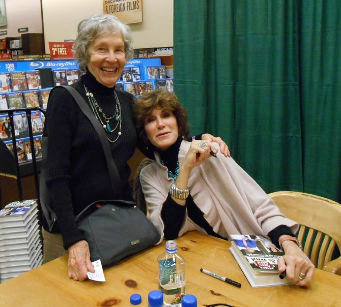 Nancy Macklin has her book signed by Mary Matalin.