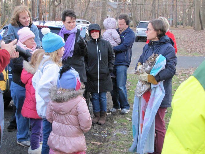 Jill and John Phillips gathered with friends and neighbors to witness the release of a Great Horned Owl who was rescued on their Potomac property less than a week earlier.