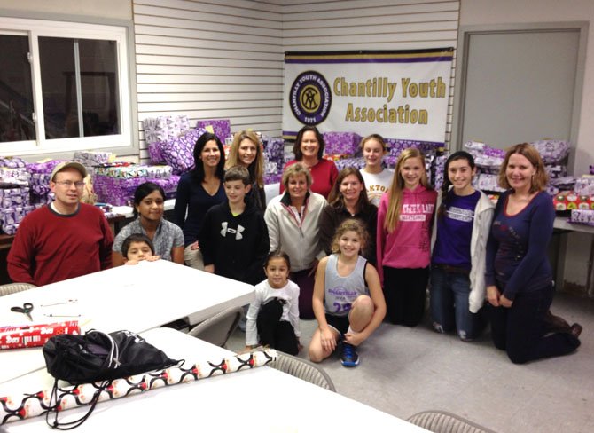 CYA members gathered to wrap all the presents for the families.  