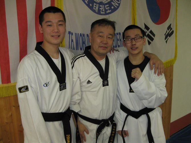 From left: Sohwon, 17, and Siwon Kim, 15, with their dad Master Han Kim.