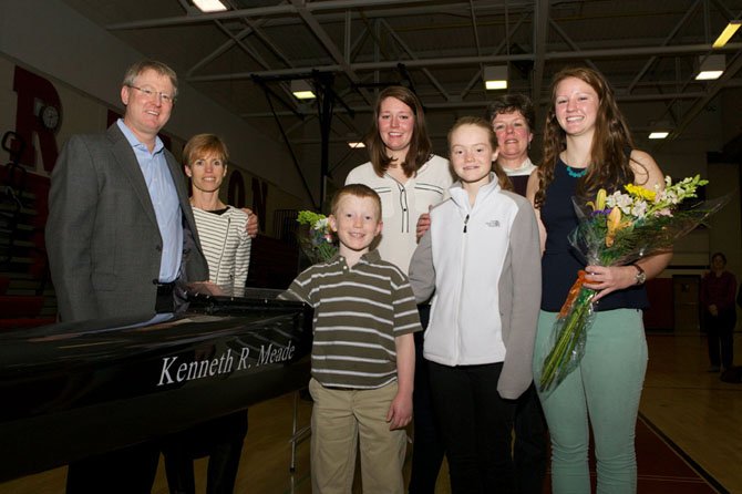 Friends and family members of Ken Meade gathered in the McLean High School gymnasium on Saturday, Jan. 10 for the christening of the newly acquired Resolute racing shell named in honor of Ken Meade, father of Cammie and Allie Meade who rowed for the McLean High School Crew Club (MCC). 
