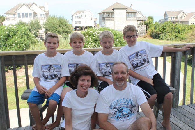From left: Twins Christopher and Jonathan, 11, and their 13-year-old twin brothers, Timothy and Danny, pictured with parents Linda and Peter Gulyn have a consistent bedtime and structured bedtime routine. Experts say a regular bedtime can have a positive impact on a child’s behavior and overall health.