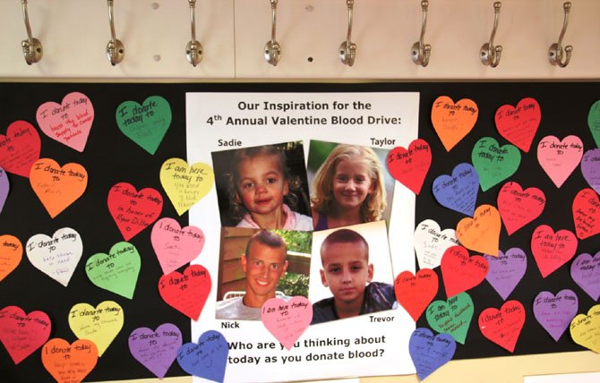 During last year’s blood drive, donors and children were given paper hearts to write reasons why they were giving blood. 