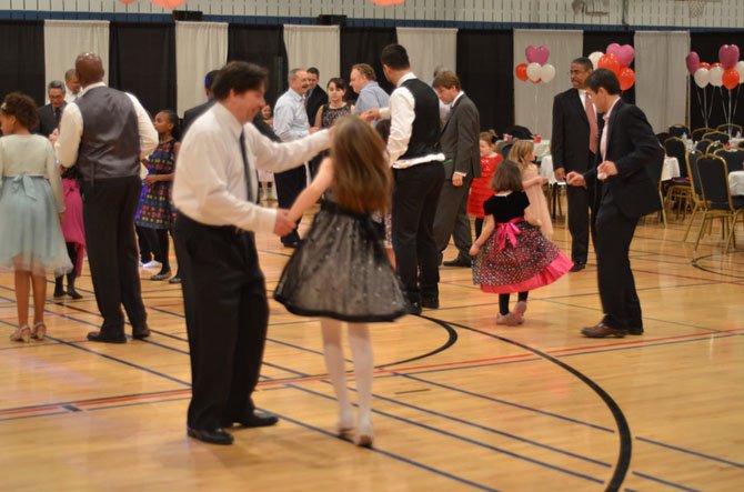 Ron Stoops, resident of Reston, dancing with his daughter at the annual February Father Daughter Dance held at Herndon Community Center.