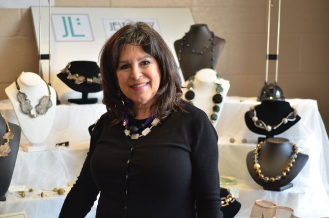 Melanie Ferrara standing near her jewelry display at McLean Community Center. Her website is www.jewelrylink.us.