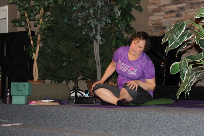 Sandy Rogers leads a Holy Yoga class at Knollwood Community Church in Burke. The class takes place Tuesdays and Thursdays.