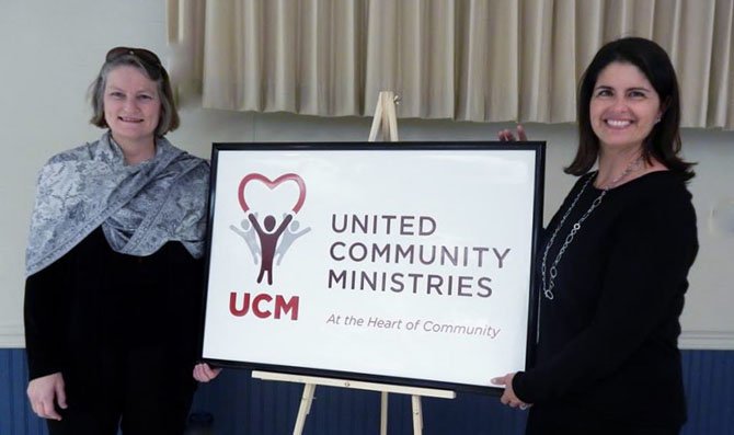  UCM executive director Shirley Marshall and Board President Gigi Hyland unveil UCM’s new logo at the organization’s Capital Steps Benefit in January. 
