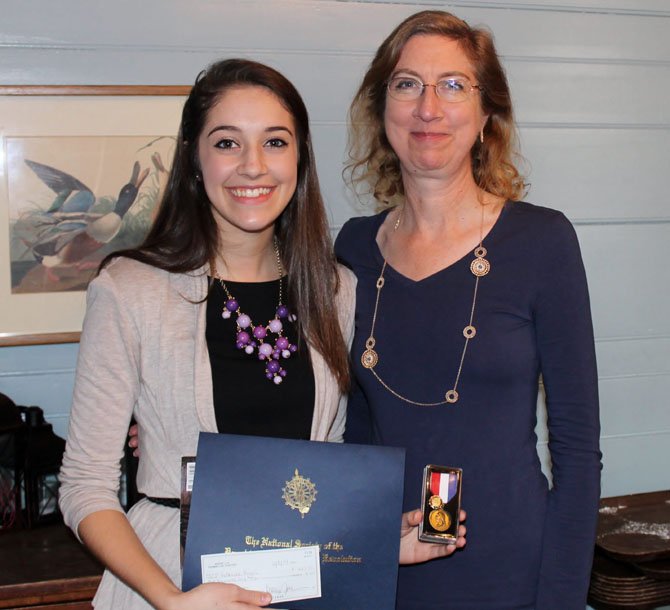 Katie Rogers, a senior at Robinson, stands with her mother Mariana Vervena after receiving the DAR Good Citizen award. 

