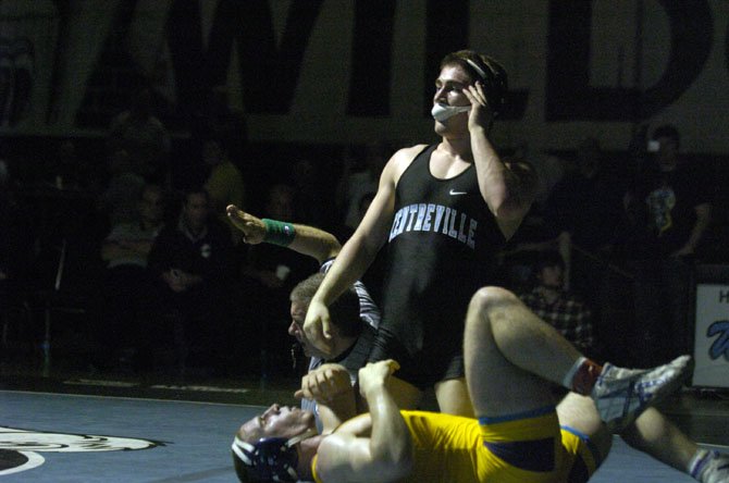 Centreville junior Tyler Love pinned Lake Braddock’s Ian Reilly to win the 195-pound championship at the 6A North region wrestling meet on Feb. 16 at Centreville High School.