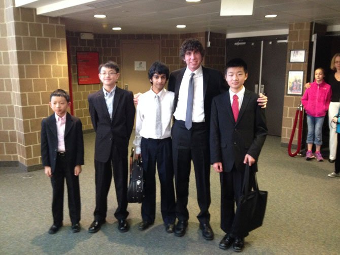 The musicians stand together in the Alden Theatre lobby following the performance. From left: Victor Pan, Evan Hu, Shankar Balasubramanian, Adam Heins, and Kevin Wang.