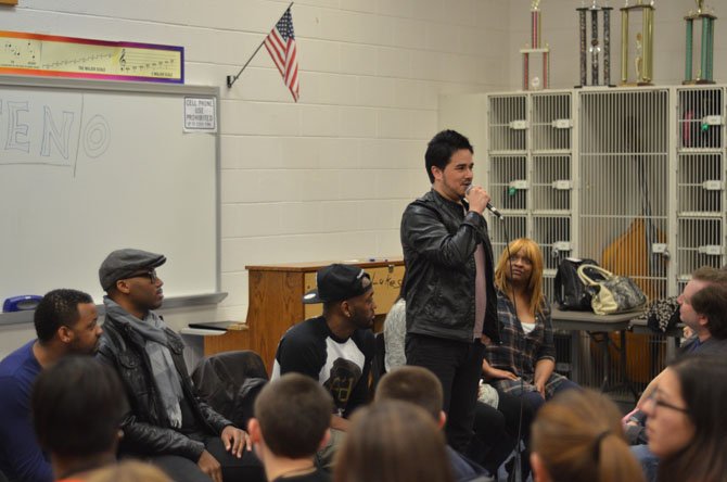 John “Jontez” Montes, singer in the Dallas based vocal band TEN stands up to answer a question at South Lakes High School in Reston. 
