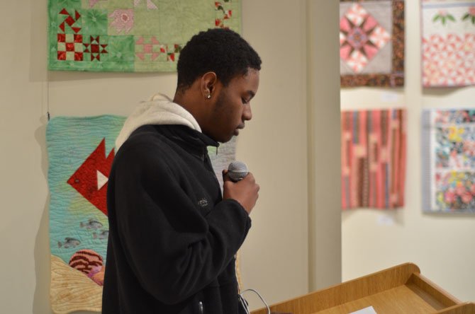 Malik Piersol, a Westfield High School senior, speaks at the ArtSpace Herndon on the history of African American cuisine at ArtSpace Herndon.