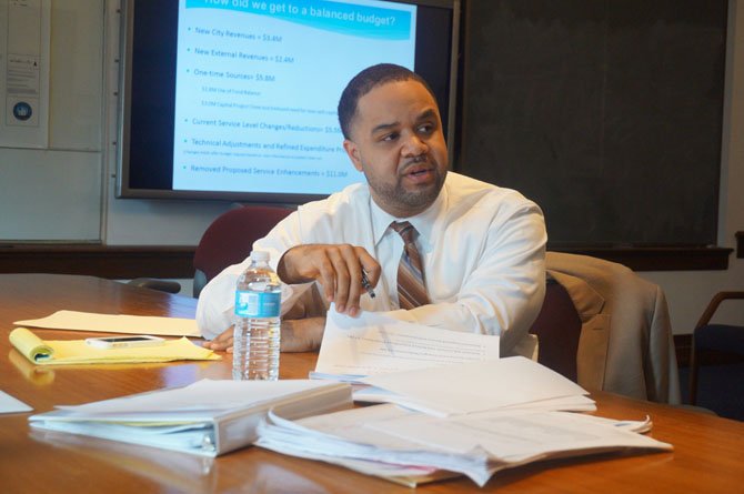 City Manager Rashad Young reviews the details of his proposed $634.8 budget for FY 2015 during a media briefing at City Hall Feb. 25.
