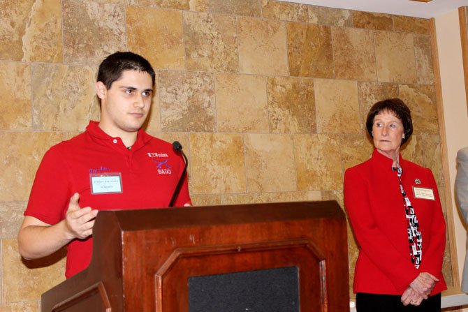 Sharon Bulova, chairman of the Fairfax County Board of Supervisors, listens as Jordan Feltcorn, a senior at Woodson High School, speaks after being recognized at the Student Peace Awards of Fairfax County on March 2.
