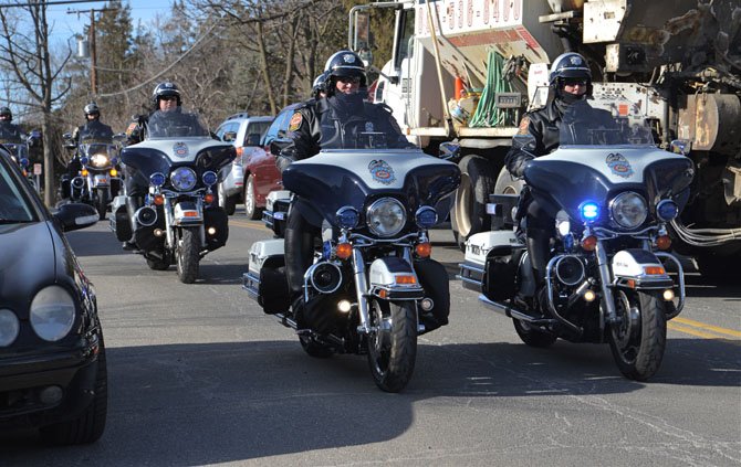 The Honor Guard – Motorcycle Police Officers clear the way as they escort the hearse carrying Vienna Mayor Jane Seeman from Vienna Presbyterian Church in Vienna to Oakton for burial at Flint Hill Cemetery.