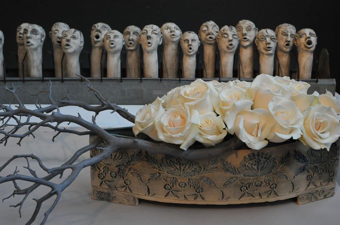 Mary M. Corley worked with "The Choir" a porcelain piece and a clay centerpiece container both by Christine Hubloue.