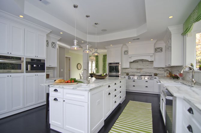 Arlington, Va., designer Allie Mann of Case Design/Remodeling, Inc. created a light filled kitchen in a McLean, Va. home with honed Vermont Marble countertops and appliances by Sub-Zero, Wolf, KitchenAid and Miele. 
 
