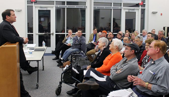 Community members listen as Supervisor Herrity addresses concerns about the proposed Fairfax County budget.
