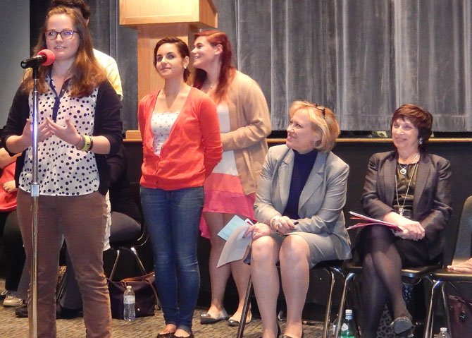 (From left) Senior Robyn Smith explains Active Minds while Lindsay Laiks, Rachel Chalkley, Karen Garza and Kim Dockery listen.