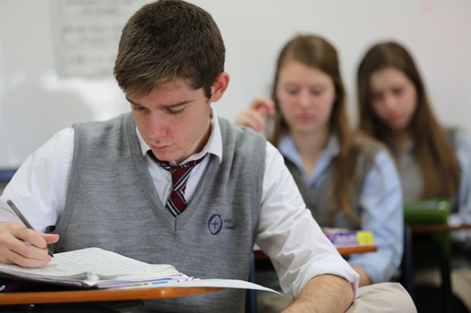 Students at Bishop O’Connell High School in Arlington, attend an English class. Experts say strong reading and writing skills will help students on standardized tests.