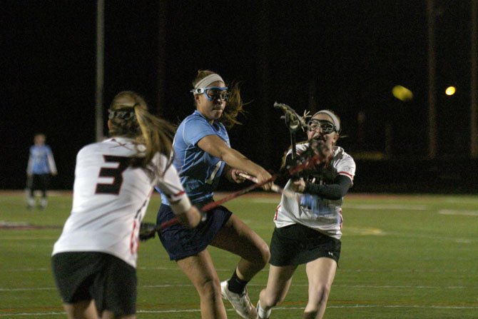 Yorktown junior Kristen Somers shoots during a scrimmage at Herndon High School on March 14.
