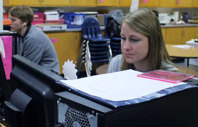 Camille Sides, a co-editor of Above and Beyond, works on yearbook layout during class. Sides was editor of last year’s yearbook, along with Gwendolyn Apgar, and Annie Goetz, which was just named a finalist for the National Scholastic Press Association Yearbook Pacemaker awards.