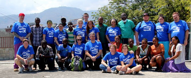 A group that went on the mission trip with their Haitian hosts.
